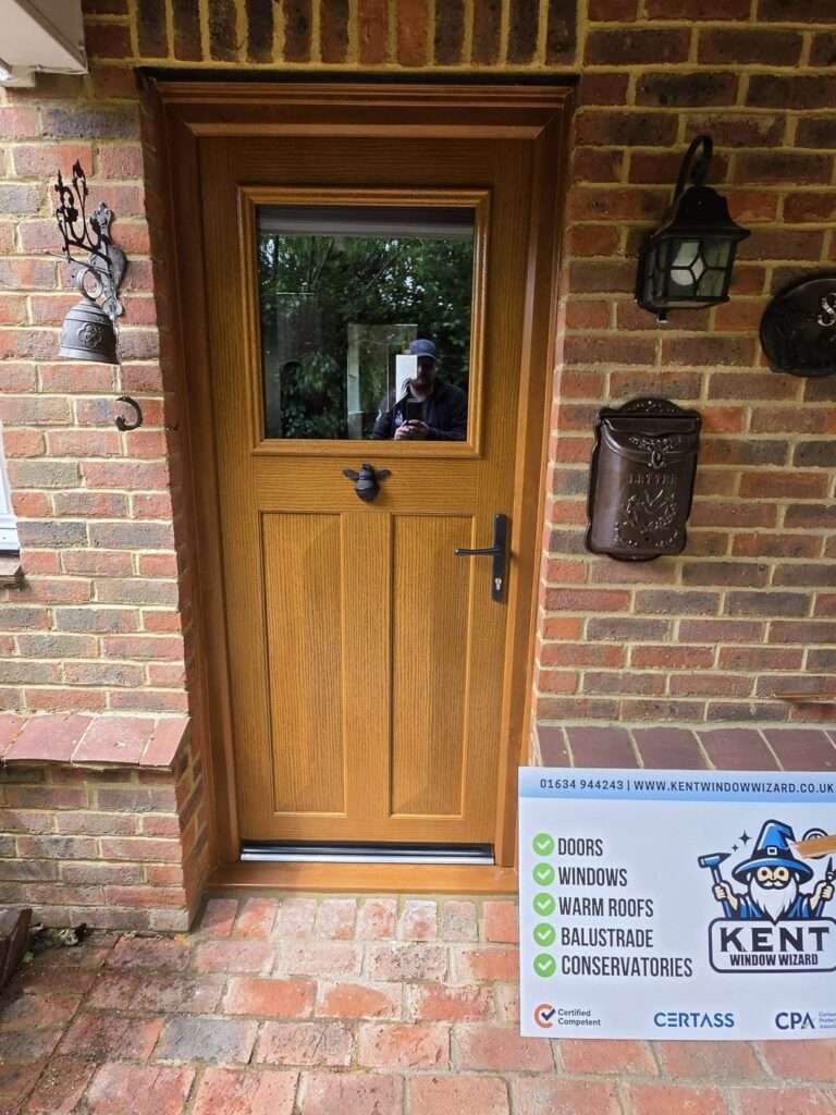 Oak-effect composite front door with glazed top panel