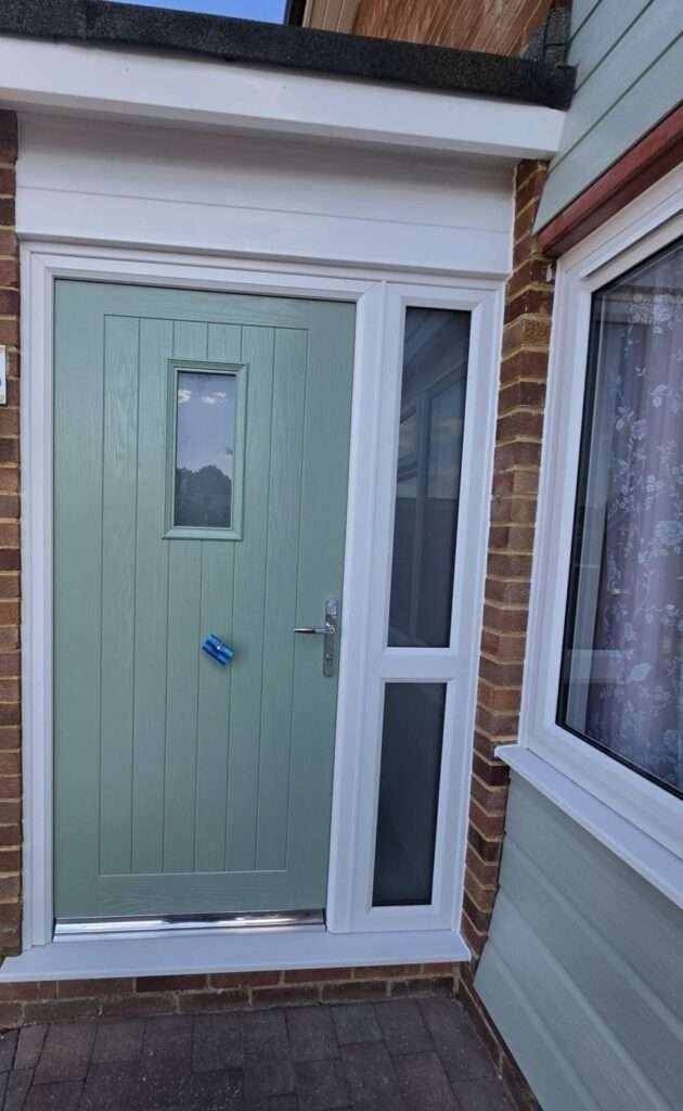 Sage green composite front door with glazed side panel