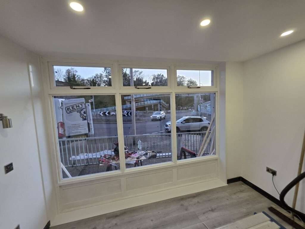 New white shopfront windows seen from inside a refurbished shop