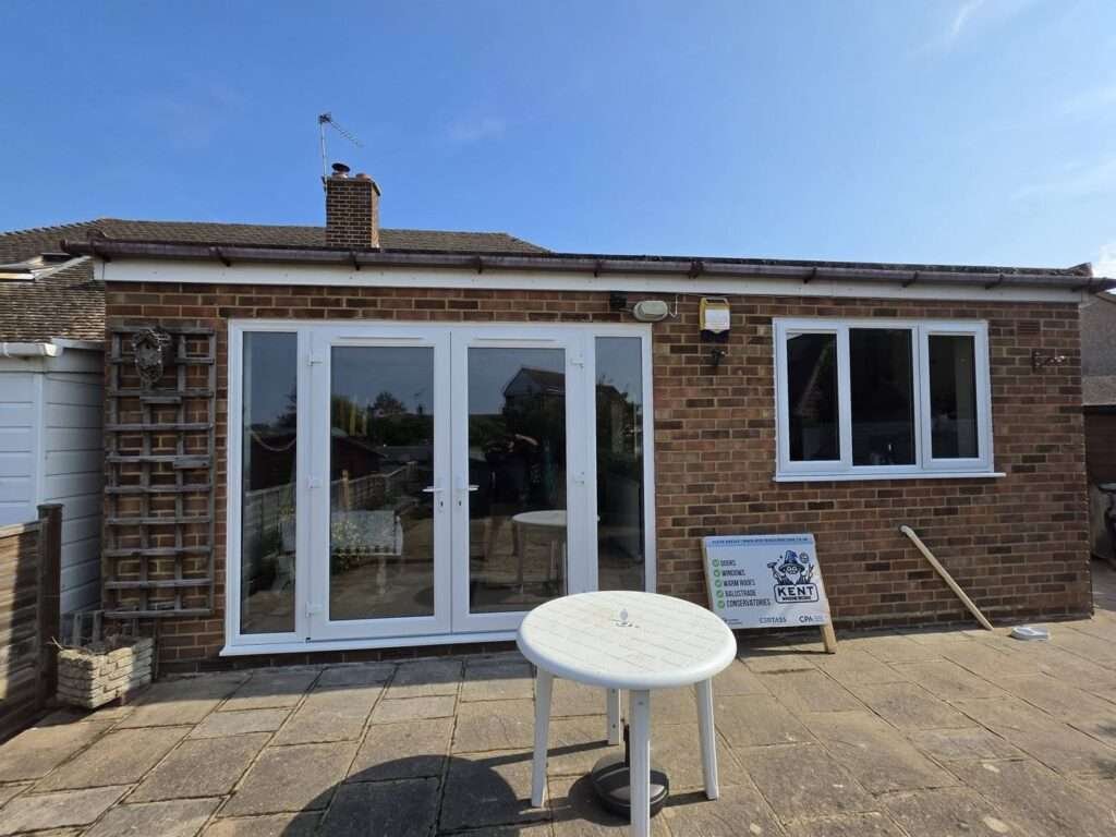 White uPVC French doors and window on a rear extension