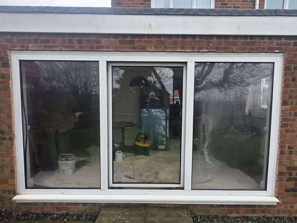 Three-pane white uPVC sliding patio door