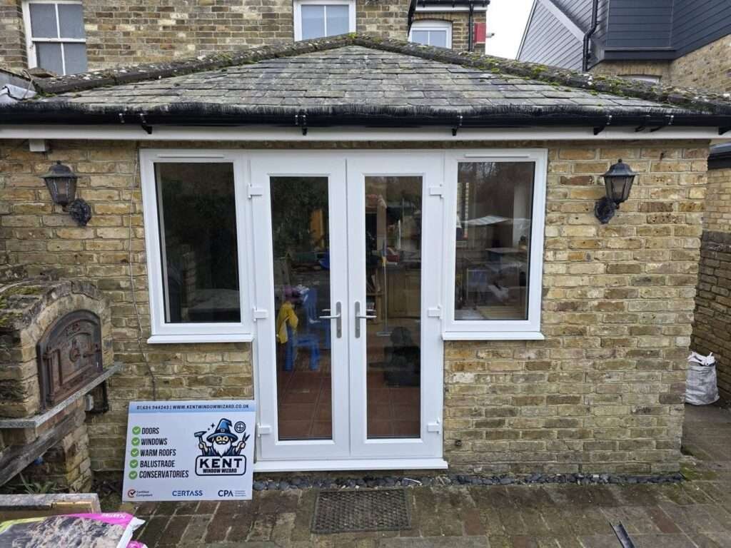 White uPVC French doors with side windows on a rear extension