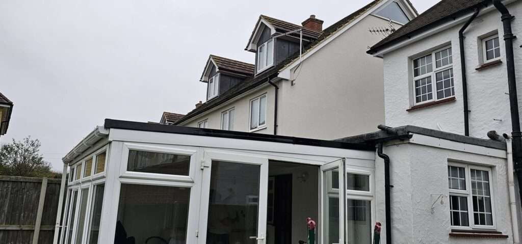 White uPVC conservatory with a new solid warm roof